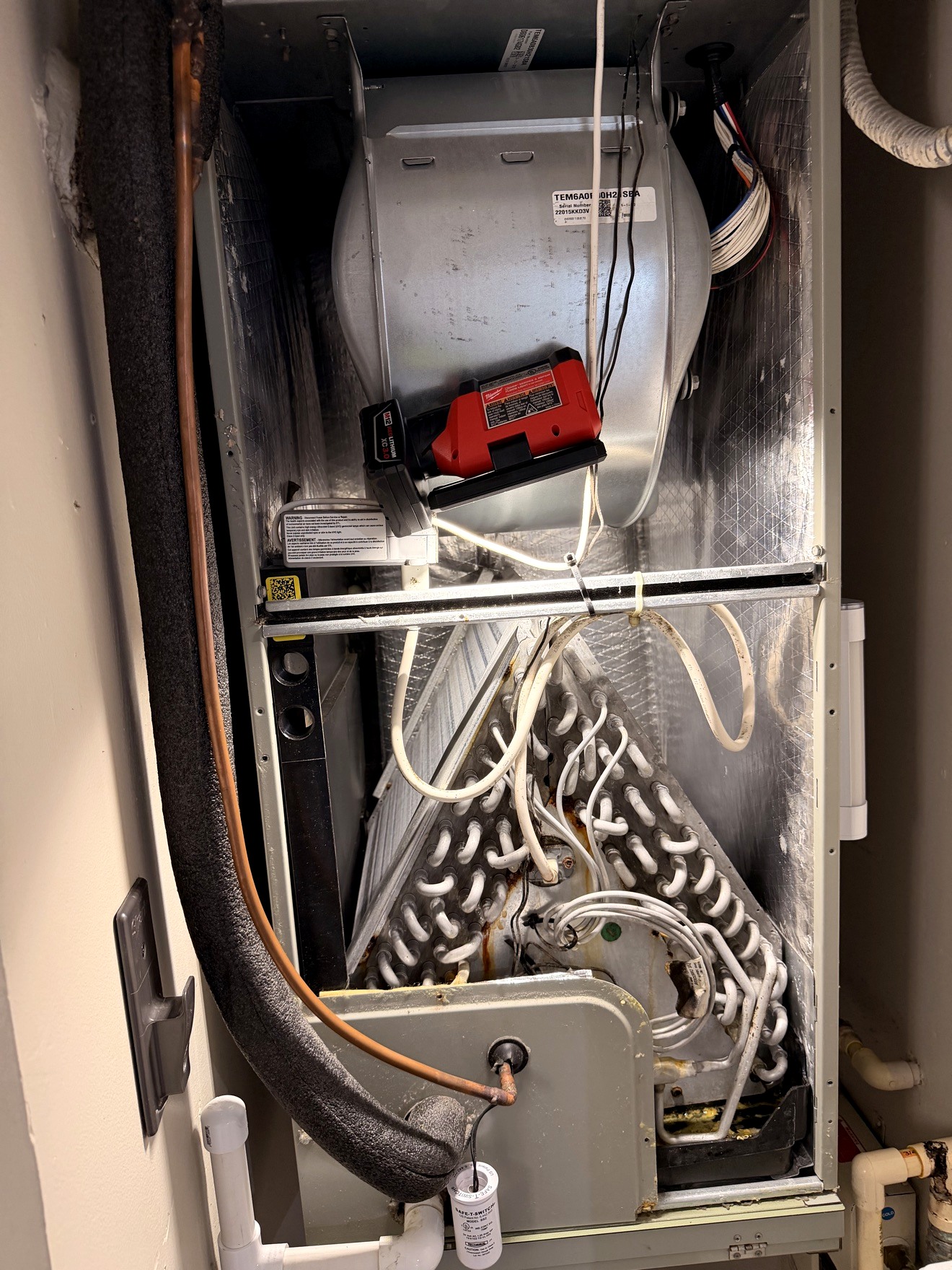 Open air handler cabinet during detailed HVAC service