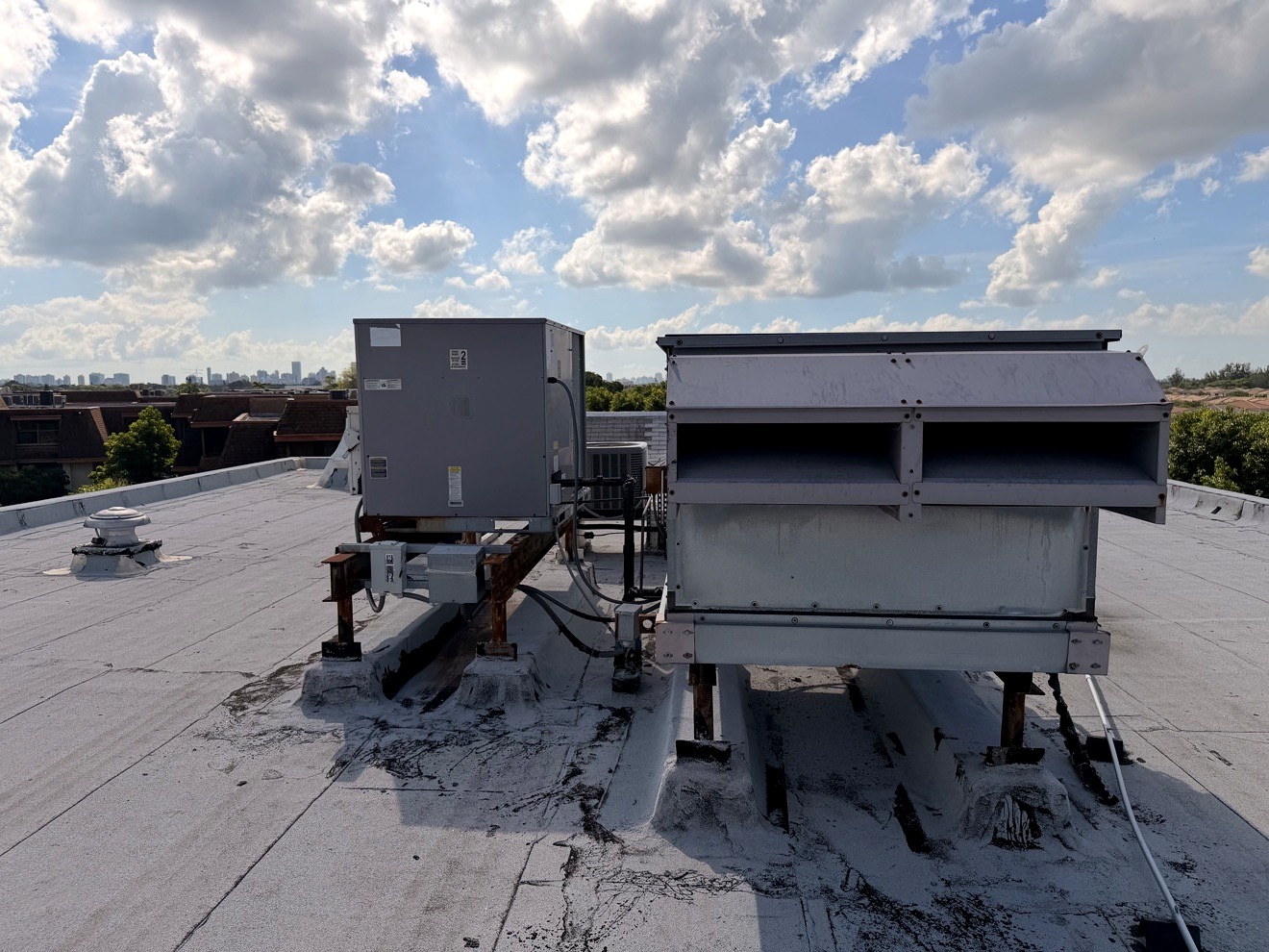Rooftop HVAC equipment being assessed
