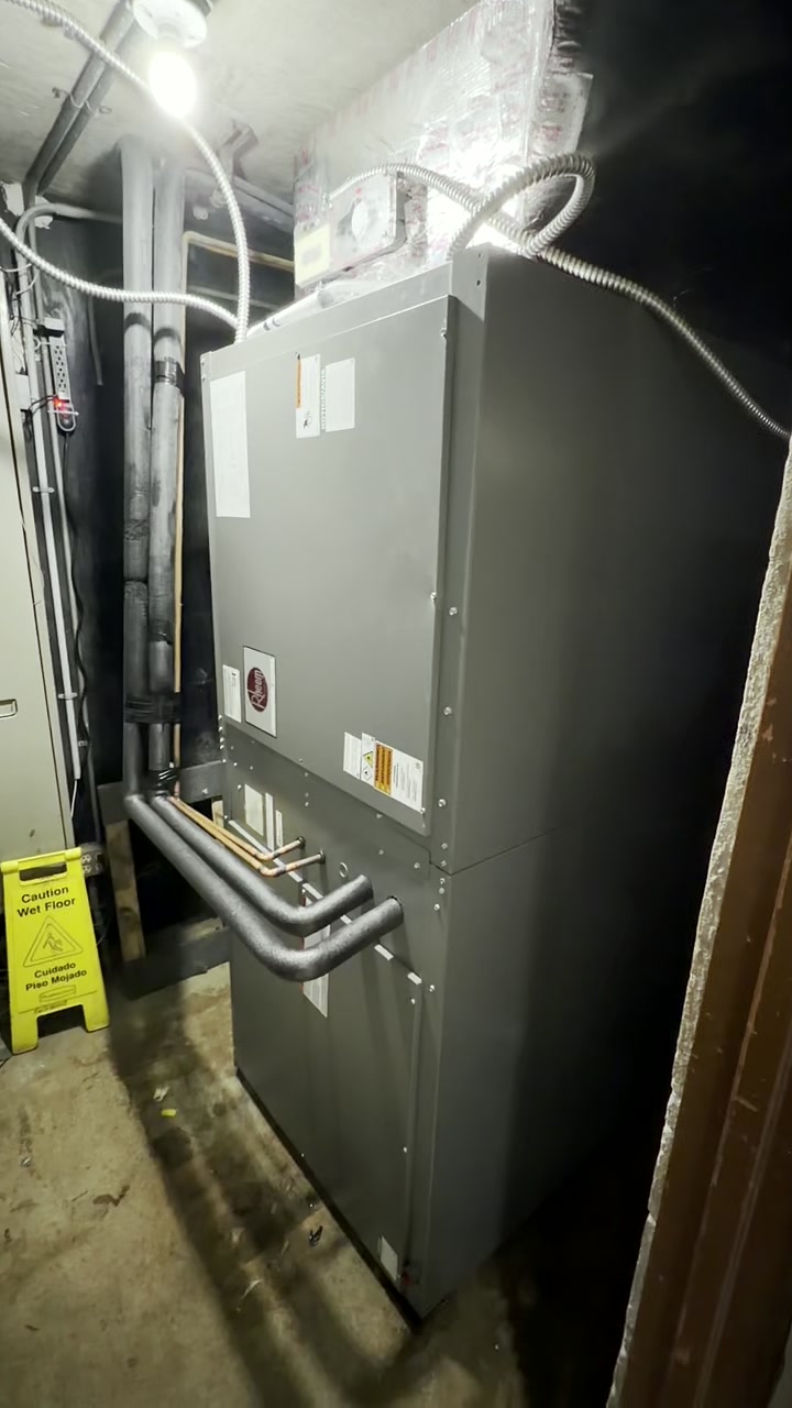 Installed air handler and insulated piping in a mechanical room