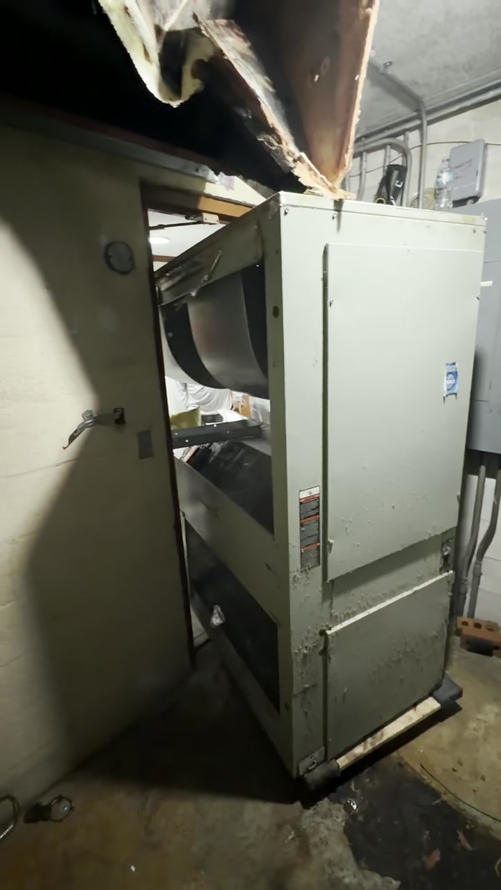 Open vertical air handler during inspection and service