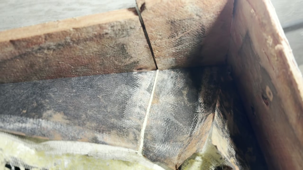 Close inspection of deteriorated ductwork and insulation